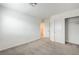 Bright bedroom featuring neutral carpet, a closet, and a doorway at 8056 Haywood Estate Ave, Las Vegas, NV 89113