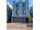 Modern three-story home features a two-car garage and sleek architectural design at 8056 Haywood Estate Ave, Las Vegas, NV 89113