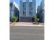 A modern three-story home features a two-car garage, stucco exterior, and manicured landscaping at 8056 Haywood Estate Ave, Las Vegas, NV 89113