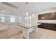 Bright kitchen with center island, granite countertops, recessed lighting, and tile floors, with open access at 8056 Haywood Estate Ave, Las Vegas, NV 89113