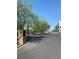 Gated community entrance with stone accents and landscaped areas at 8056 Haywood Estate Ave, Las Vegas, NV 89113