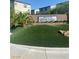 Community entrance with manicured landscaping and attractive signage at 8056 Haywood Estate Ave, Las Vegas, NV 89113