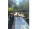 The park's sidewalk meanders past seating areas, artificial turf, trees and low-maintenance landscaping at 8056 Haywood Estate Ave, Las Vegas, NV 89113