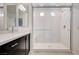 Contemporary shower with glass door, marble surround, and built-in bench at 8056 Haywood Estate Ave, Las Vegas, NV 89113