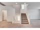 Carpeted staircase with white railing and natural light from a window, leading to the second floor at 8056 Haywood Estate Ave, Las Vegas, NV 89113