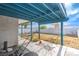 The covered patio overlooks the spacious backyard with ample room for outdoor activities at 824 Schooner Dr, Henderson, NV 89015