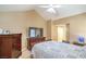 Bedroom with sloped ceiling, classic furniture, and a flatscreen TV for entertainment at 824 Schooner Dr, Henderson, NV 89015