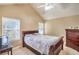 Cozy bedroom with sloped ceiling, a comfortable bed, and classic wooden furniture at 824 Schooner Dr, Henderson, NV 89015