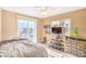 Bright bedroom with sliding glass doors to a balcony, offering views and a comfortable sleeping space at 824 Schooner Dr, Henderson, NV 89015