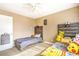 Neutral bedroom featuring two twin beds and a white door leading to an additional room or closet at 824 Schooner Dr, Henderson, NV 89015