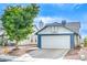 Charming single-story home with a well-maintained lawn and two-car garage at 824 Schooner Dr, Henderson, NV 89015