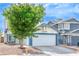 Charming single-story home with a well-maintained lawn and two-car garage at 824 Schooner Dr, Henderson, NV 89015