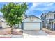 Charming single-story home with a well-maintained lawn and two-car garage at 824 Schooner Dr, Henderson, NV 89015