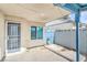 Home's outdoor patio features a fenced yard, window, and door for easy access at 824 Schooner Dr, Henderson, NV 89015