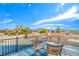 Secluded rooftop patio with seating, offering panoramic views of the neighborhood and distant mountains at 824 Schooner Dr, Henderson, NV 89015