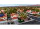 This home in an established community features mature landscaping, a separate garage, and well-manicured lawns at 8388 Brad Oaks Cir, Las Vegas, NV 89123