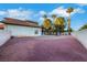 Spacious backyard featuring desert landscaping, mature trees, and privacy walls for serene outdoor living at 8388 Brad Oaks Cir, Las Vegas, NV 89123