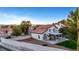Home featuring a backyard with covered patio, lush lawn, and mountain views at 8388 Brad Oaks Cir, Las Vegas, NV 89123