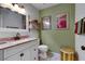 Charming bathroom with framed art, vanity, and stylish fixtures at 8388 Brad Oaks Cir, Las Vegas, NV 89123