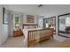 Cozy bedroom featuring a comfortable bed, mirrored closet doors, and natural light from the windows at 8388 Brad Oaks Cir, Las Vegas, NV 89123