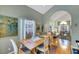 Dining room showcasing hardwood floors and an arched entryway at 8388 Brad Oaks Cir, Las Vegas, NV 89123
