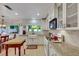 Bright kitchen featuring a farmhouse sink, granite countertops, and modern appliances at 8388 Brad Oaks Cir, Las Vegas, NV 89123