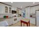 Updated kitchen with white cabinets, granite counters, and stainless appliances at 8388 Brad Oaks Cir, Las Vegas, NV 89123