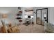Bright office space with a desk, shelving, and comfortable seating at 8388 Brad Oaks Cir, Las Vegas, NV 89123