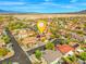 Panoramic aerial view of a neighborhood featuring well-manicured lawns and scenic desert landscapes at 8723 Melissa Meadows St, Las Vegas, NV 89131