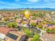 Neighborhood aerial view featuring mature trees, well-kept homes, and mountain views in the background at 8723 Melissa Meadows St, Las Vegas, NV 89131