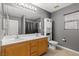 Well-lit bathroom boasts a double sink vanity and a large mirror and neutral color at 8723 Melissa Meadows St, Las Vegas, NV 89131