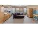 Bright primary bedroom with comfortable chaise lounge and wood furnishings at 8723 Melissa Meadows St, Las Vegas, NV 89131