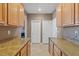 Butler's pantry features light wood cabinetry and granite countertops at 8723 Melissa Meadows St, Las Vegas, NV 89131