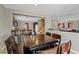 The dining area provides a view of the kitchen, staircase, and living area through its open concept design at 8723 Melissa Meadows St, Las Vegas, NV 89131