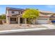 Two-story home features a neutral color scheme, large garage, and solar panels at 8723 Melissa Meadows St, Las Vegas, NV 89131