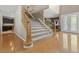 The front foyer has wood floors and a carpeted staircase leading to the upper level of the home at 8723 Melissa Meadows St, Las Vegas, NV 89131