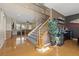 Two-story foyer leads to an open floor plan featuring hardwood floors and a staircase at 8723 Melissa Meadows St, Las Vegas, NV 89131