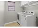 Efficient laundry room featuring modern, front-loading washer and dryer at 8723 Melissa Meadows St, Las Vegas, NV 89131