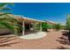 Backyard with a covered patio and desert landscaping at 8921 Signal Terrace Dr, Las Vegas, NV 89134