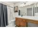 Bathroom featuring a shower, toilet, vanity, and large mirror at 8921 Signal Terrace Dr, Las Vegas, NV 89134