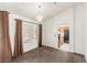 Dining room with neutral carpet, chandelier, and access to the kitchen at 8921 Signal Terrace Dr, Las Vegas, NV 89134