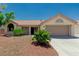 Charming single-story home featuring a desert landscape and a two-car garage at 8921 Signal Terrace Dr, Las Vegas, NV 89134