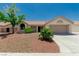 Charming single-story home featuring a desert landscape and a two-car garage at 8921 Signal Terrace Dr, Las Vegas, NV 89134