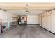 Spacious garage with built-in storage cabinets, shelving, and ample room for parking at 8921 Signal Terrace Dr, Las Vegas, NV 89134