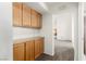 Hallway with cabinetry and view of adjoining room at 8921 Signal Terrace Dr, Las Vegas, NV 89134
