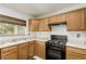 Bright kitchen featuring wood cabinets, white countertops and tile backsplash, with natural light at 8921 Signal Terrace Dr, Las Vegas, NV 89134