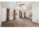Expansive living room with neutral carpet and slider door access to outdoor living at 8921 Signal Terrace Dr, Las Vegas, NV 89134