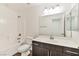 Bathroom with a single sink vanity and white shower-tub at 9050 W Tropicana Ave # 1075, Las Vegas, NV 89147