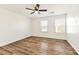 Bedroom with a ceiling fan and wood floor at 9050 W Tropicana Ave # 1075, Las Vegas, NV 89147