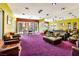Stylish lounge area with comfortable seating, sleek coffee tables, and large windows offering natural light at 9050 W Tropicana Ave # 1075, Las Vegas, NV 89147